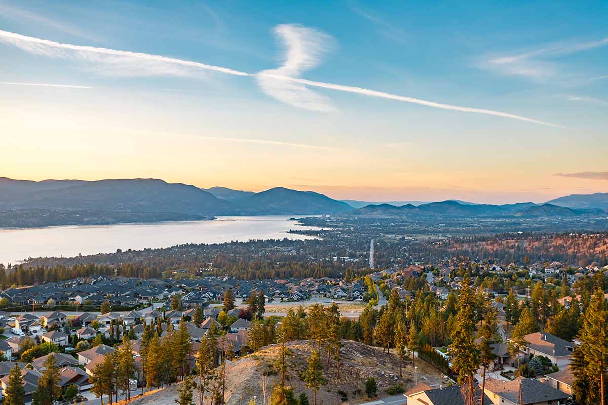 A photo of homes for sale in the Upper Mission with lake and valley views extending into the distance