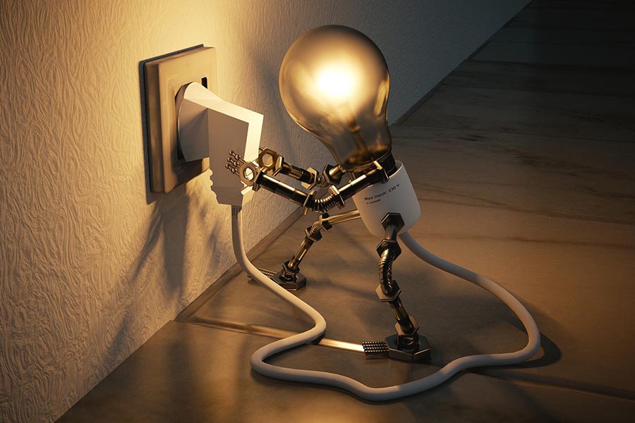 A lightbulb plugged into a wall socket