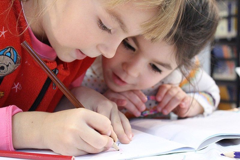 Children working on a school assignment.