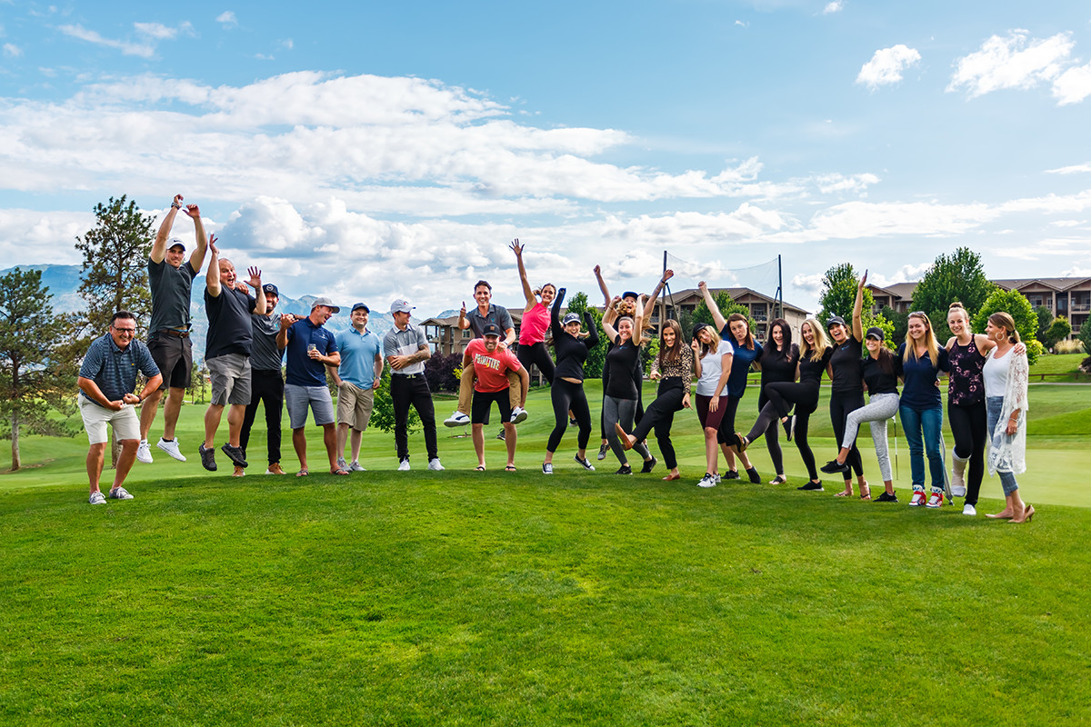 the Vantage West Realty team celebrating at a golf course in Kelowna