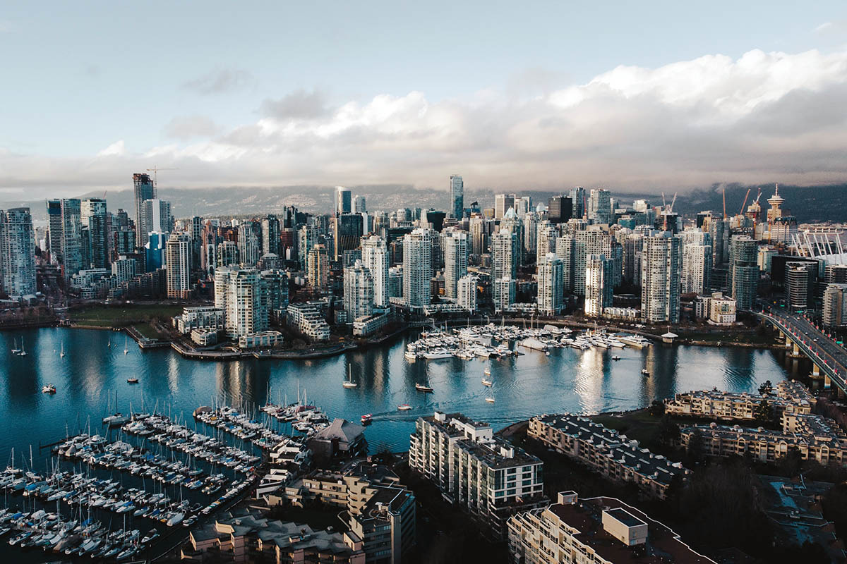 Drone photo of Downtown Vancouver Burrard Inlet with high rise condos ascending into the sky