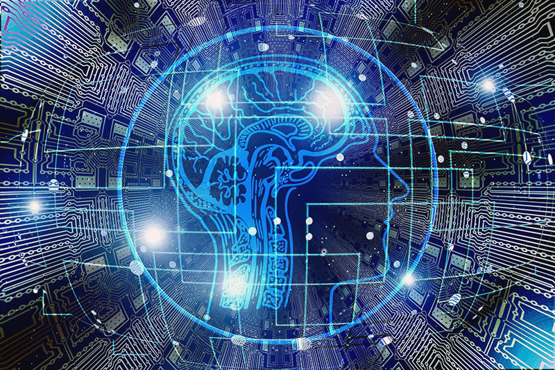 A digital image of a human head showing a brain connected to a grid of circuitry, the likes of which you might find on deviantart.com; but we got it from a stock image site!