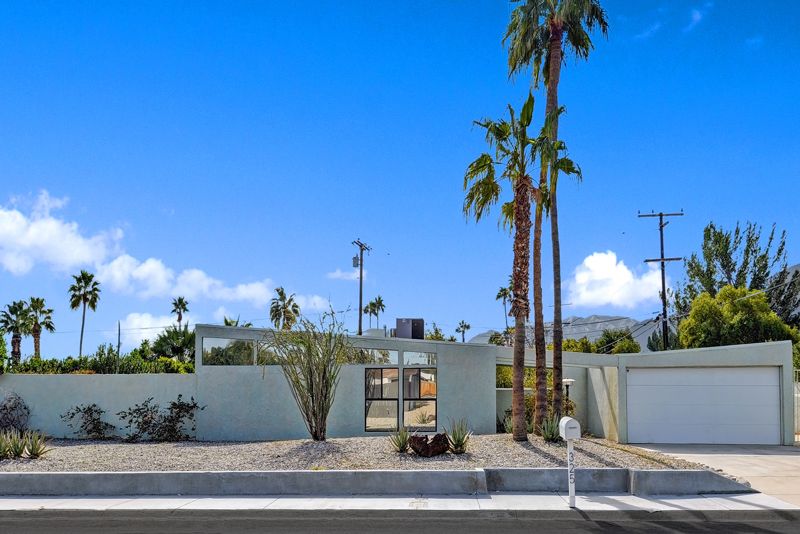 Butterfly roof home in Racquet Club Estates