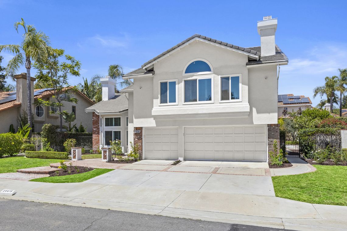 Beautiful modern exterior with manicured lawn at 20415 Via Burgos