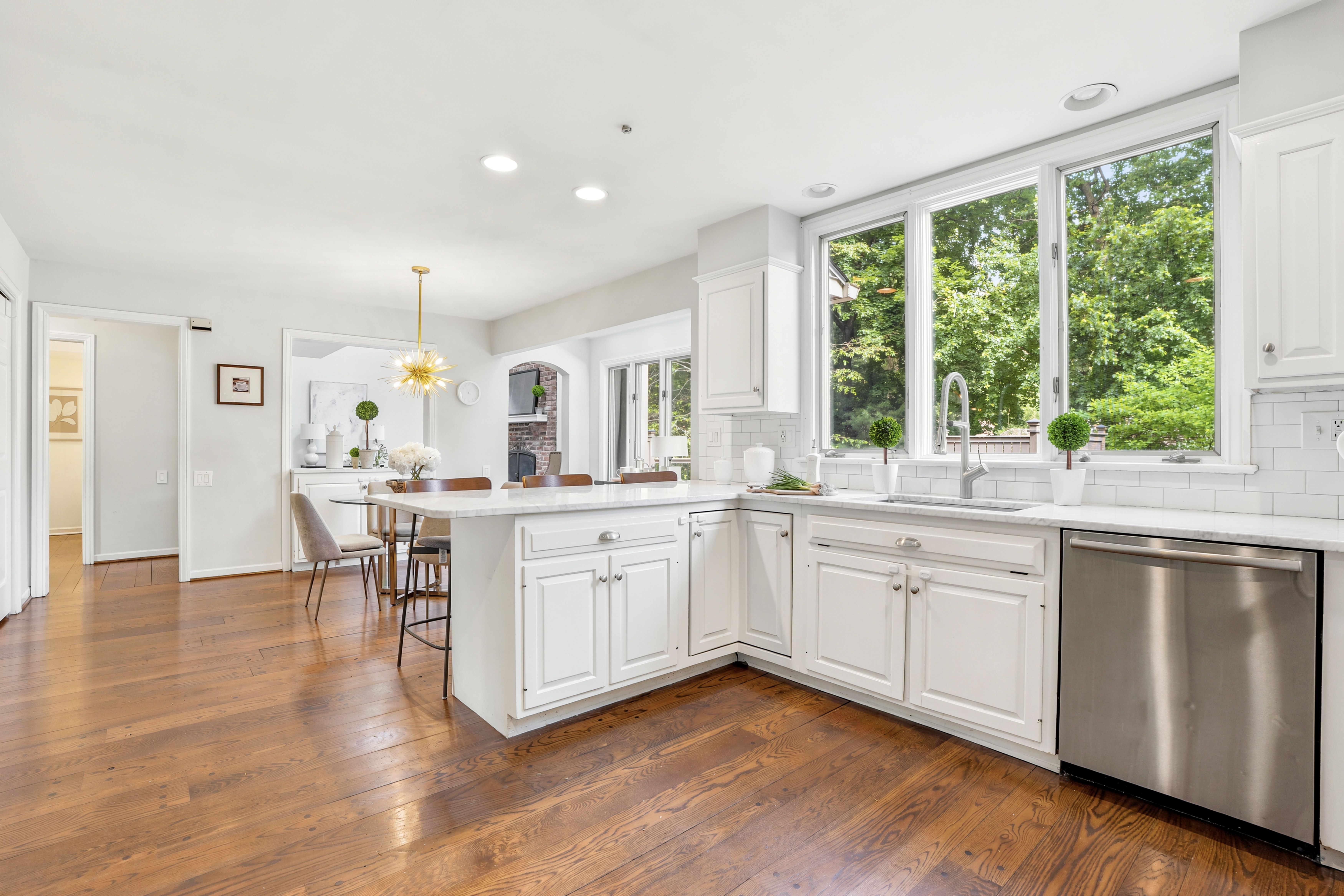 Bright Custom Kitchen Space with Stone Countertops