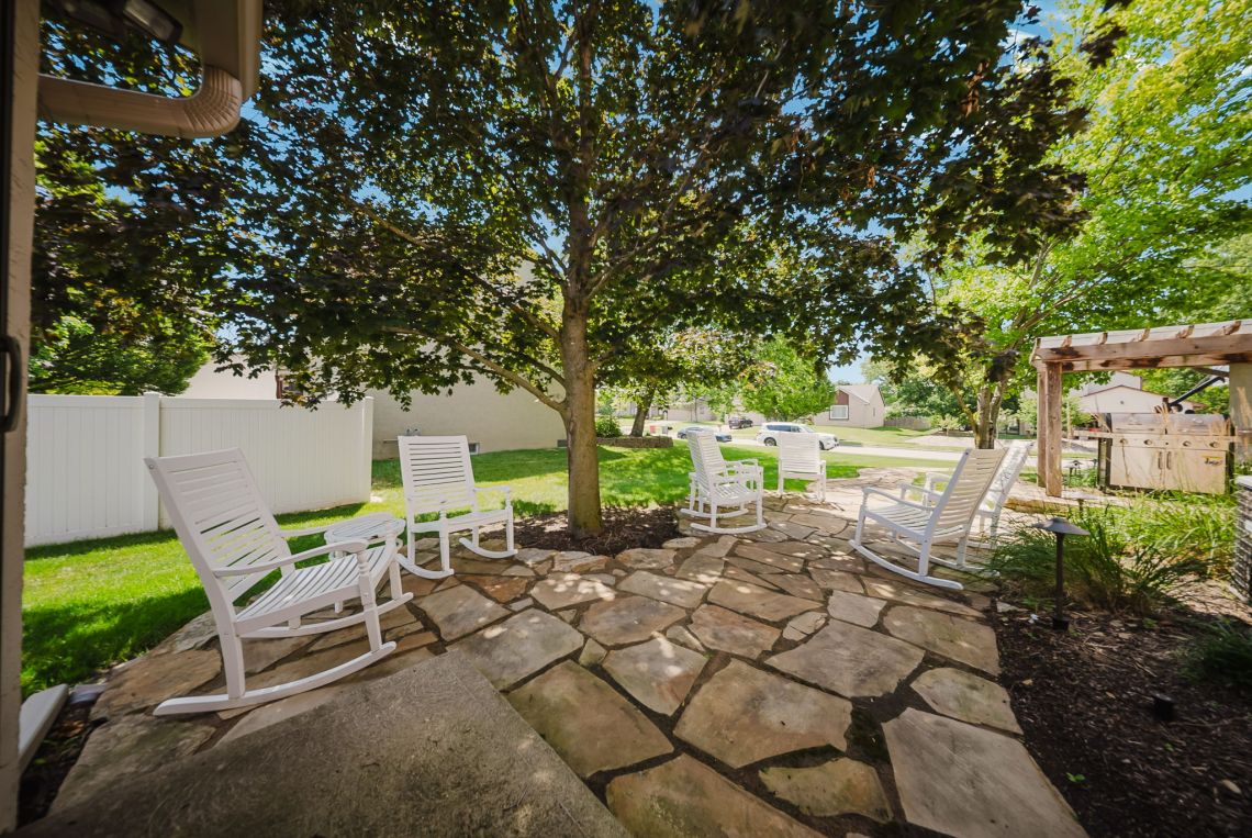 Flagstone patio with cedar pergola and grill