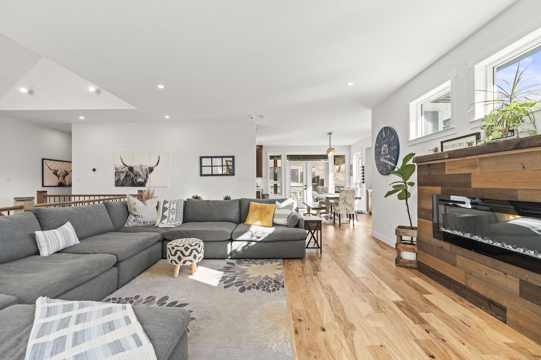 Upper-level living room with the fireplace feature wall