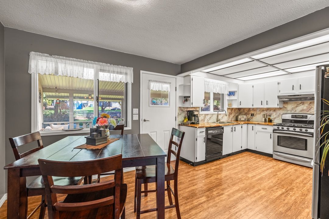 Breakfast nook and kitchen with butcher-block counters