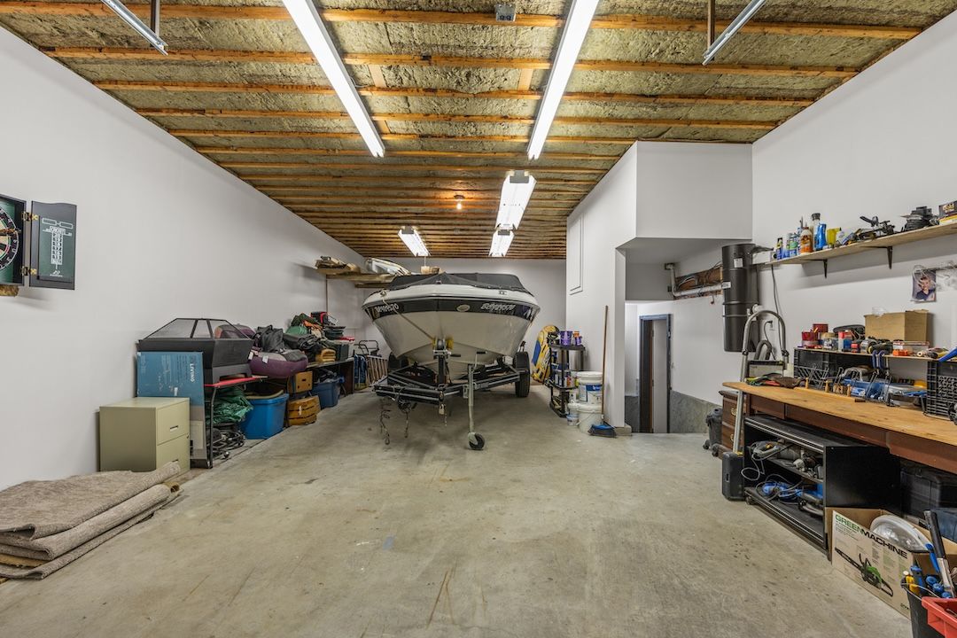 Tandem garage with a boat and a workbench