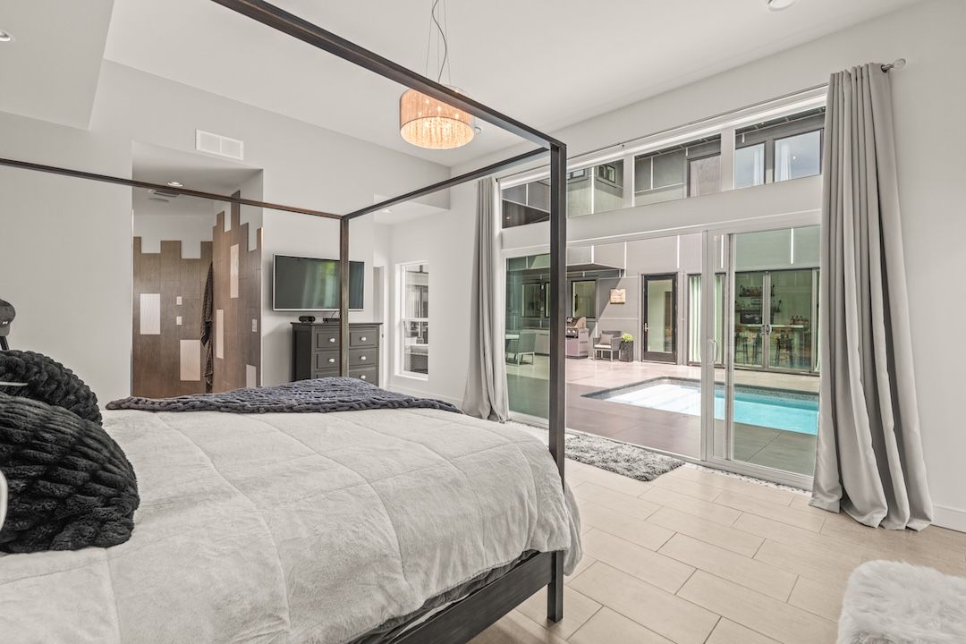 Primary bedroom with views to the courtyard pool