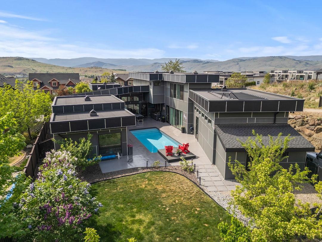 Aerial view of 811 Mt Ida Drive showing the home wrapped around its private courtyard pool