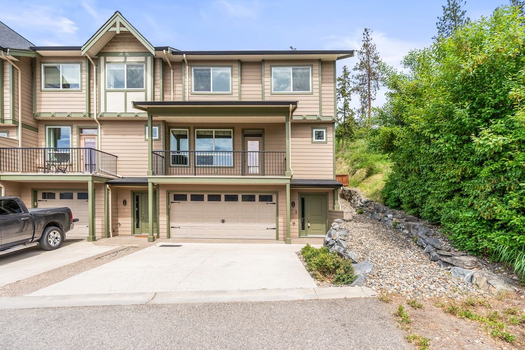 Front exterior view of the end-unit townhome at 140-3780 Schubert Road