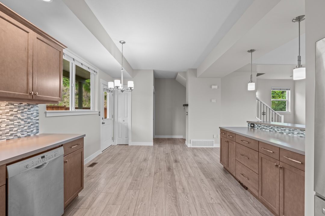 Open-concept kitchen with island and raised eating bar on the main living level
