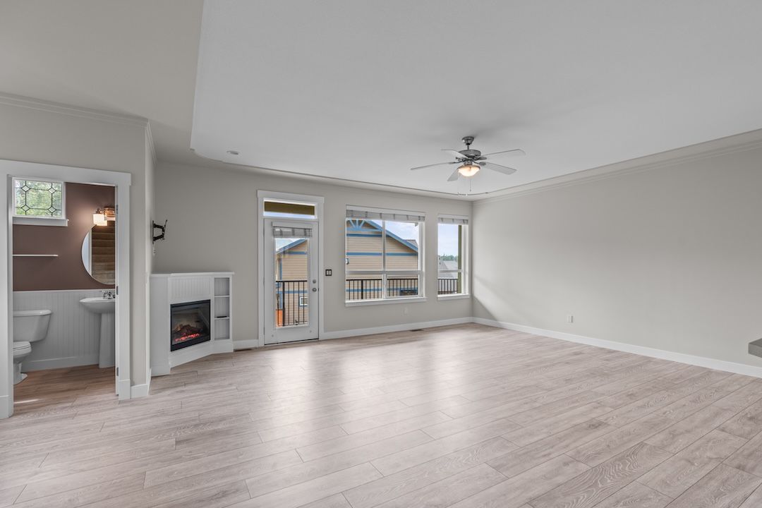 Kitchen view toward dining and living area