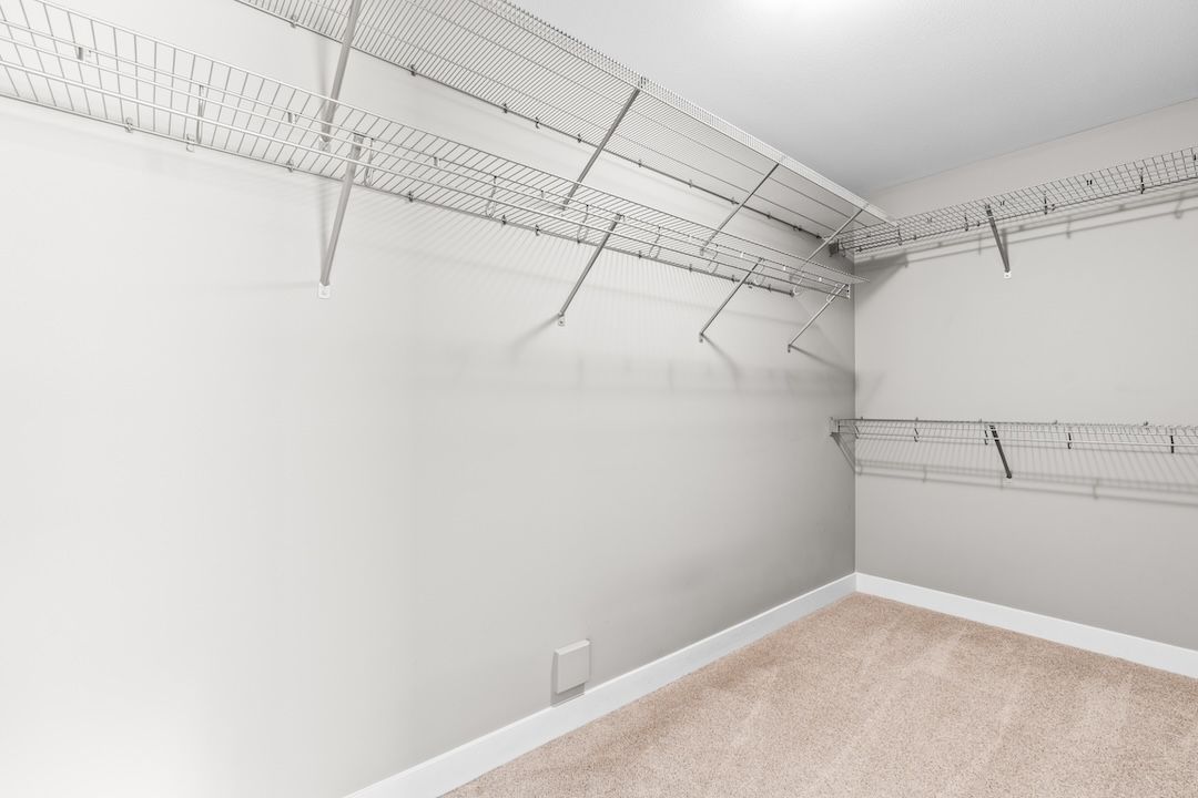 Stairs from the main level up to the top floor bedrooms