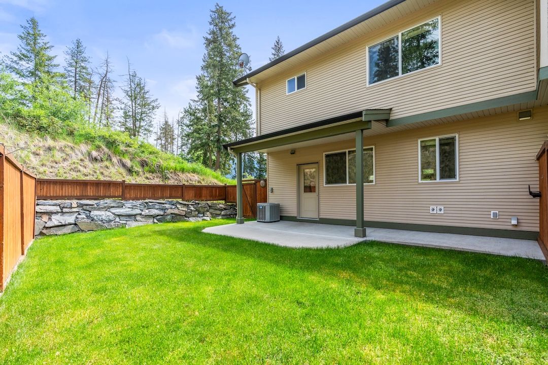 Private fenced yard at the end of the townhouse row