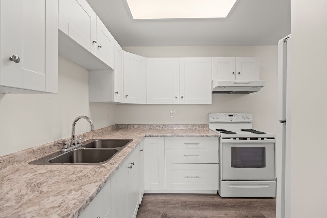 The main-level kitchen flowing into the dining area