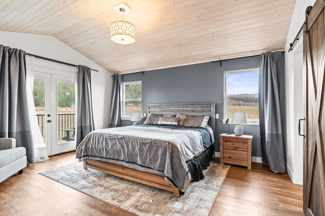 Primary bedroom with Juliet balcony at 4160 Noble Road