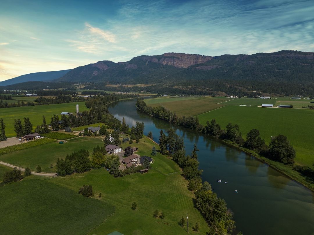 Aerial twilight view of 48 Waterside Road on the Shuswap River