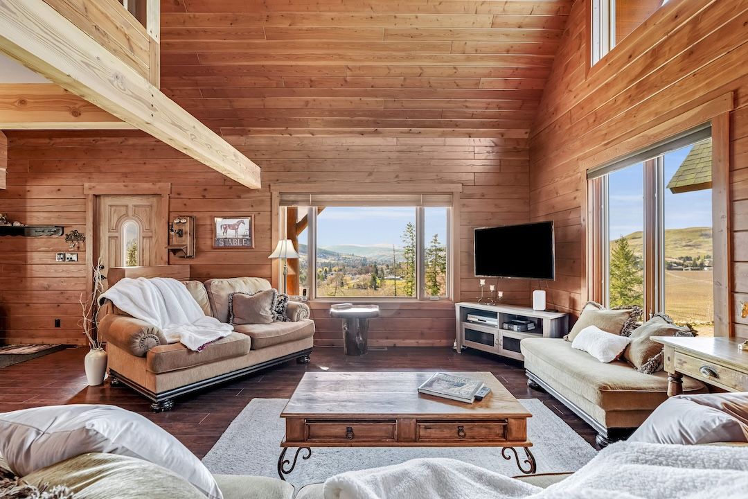 Vaulted, open living space inside the log home at 9371 Highway 6, Coldstream BC