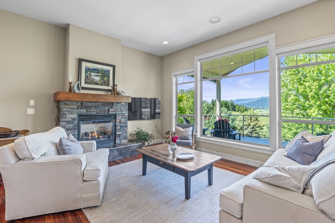 Living room with a wall of windows looking out over the Armstrong valley