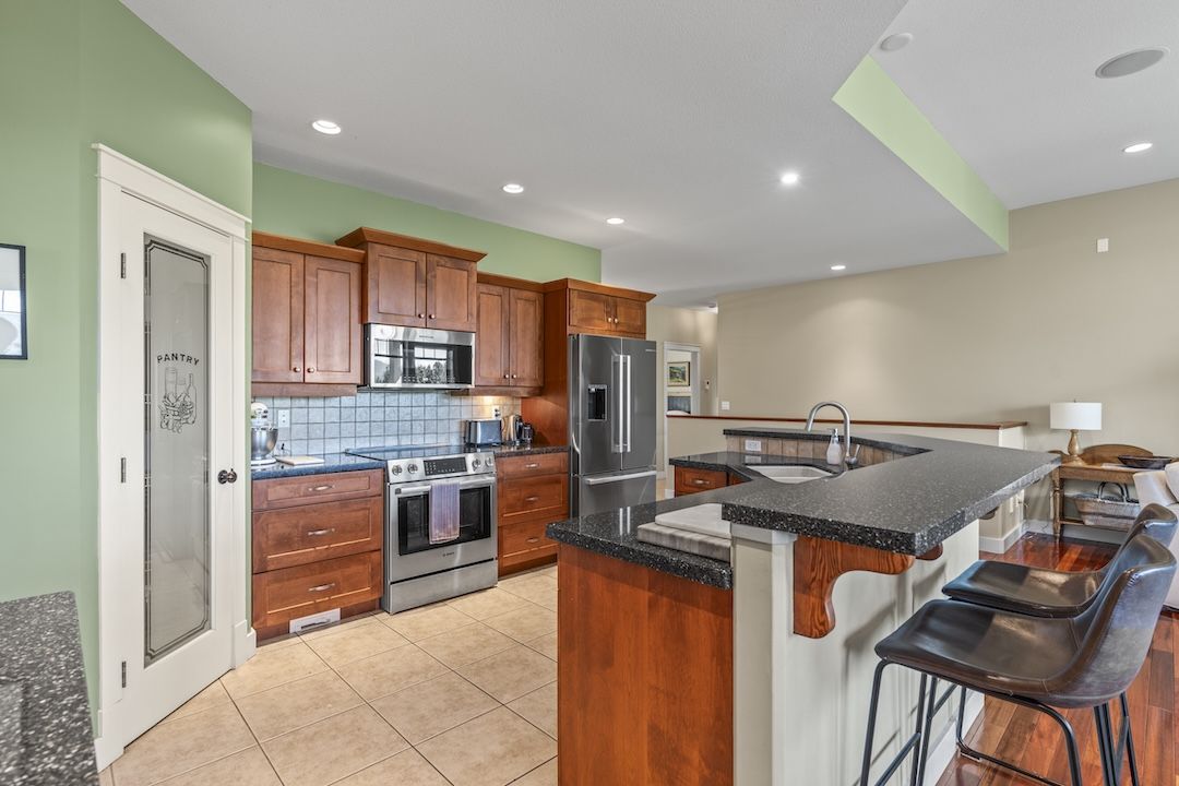 Kitchen with granite island and Bosch appliances