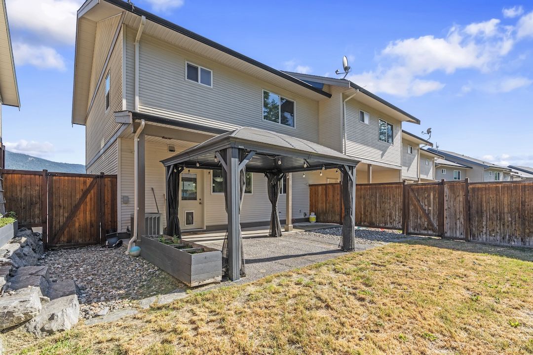 Rear exterior and fenced yard