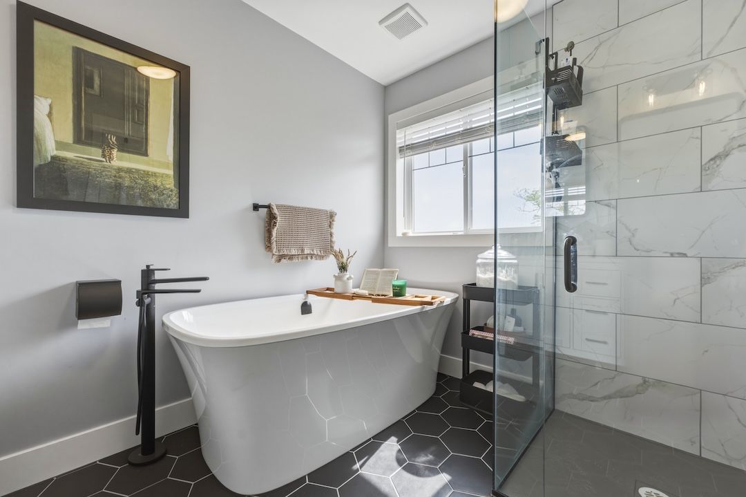 Primary ensuite with freestanding soaker tub