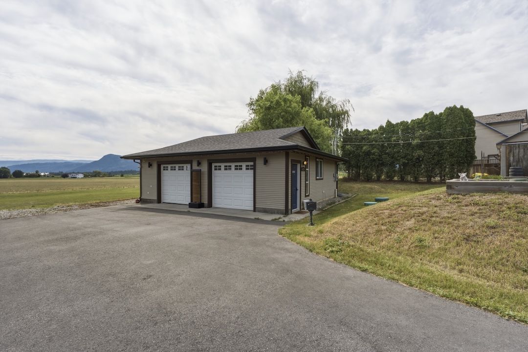 Corner view of the detached shop and yard