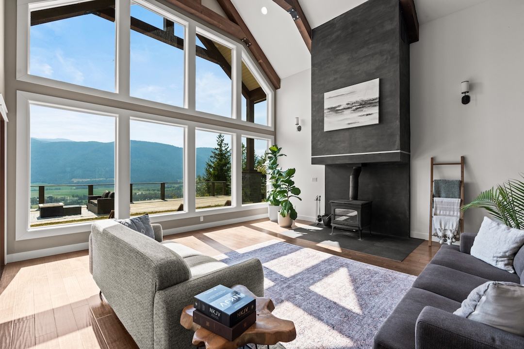 Vaulted living room with valley views and wood-burning fireplace