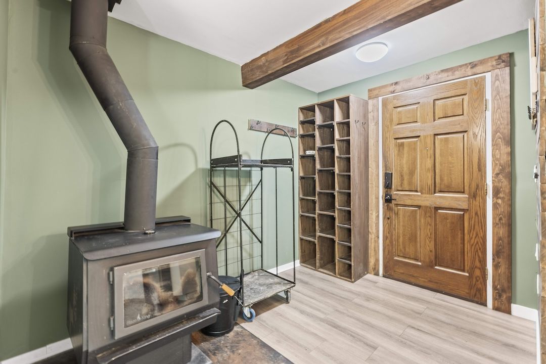 Main entry with solid wood door and built-in storage