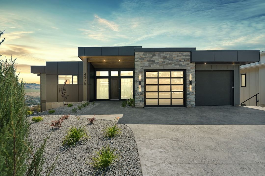 4379 Painted Turtle Drive at twilight — modern rancher with a striking lit façade