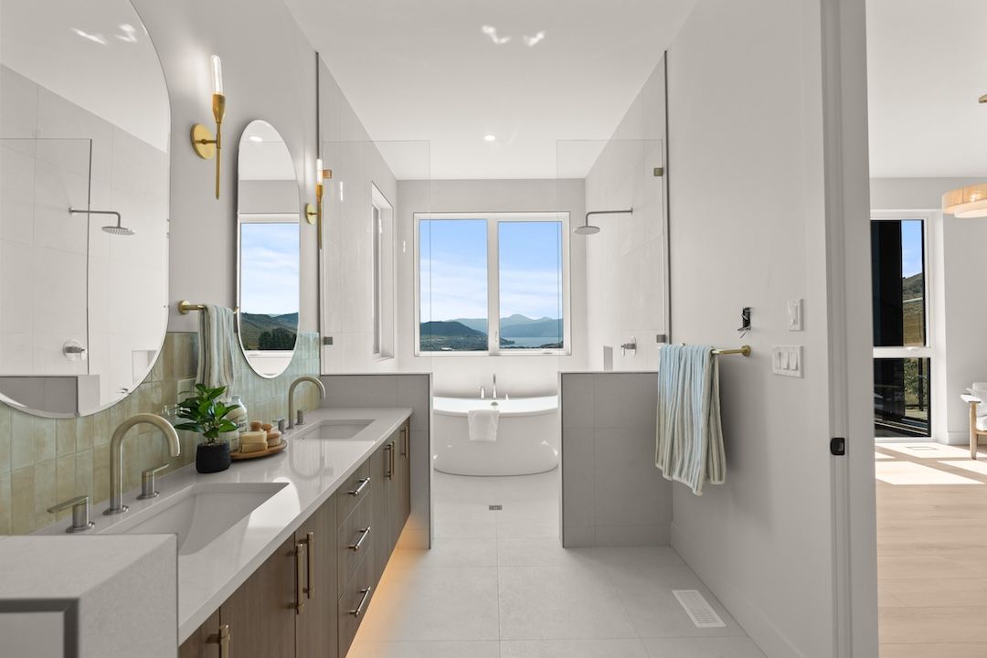 Fully tiled wet-room ensuite with freestanding tub