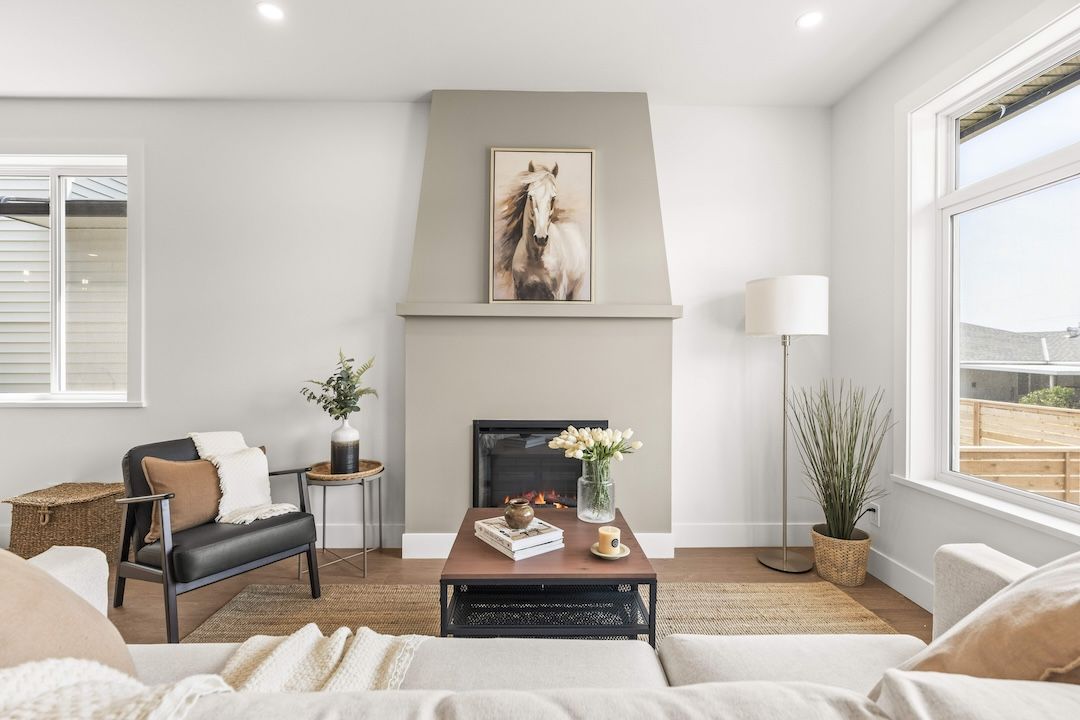Great room with laminate plank floors and a gas fireplace