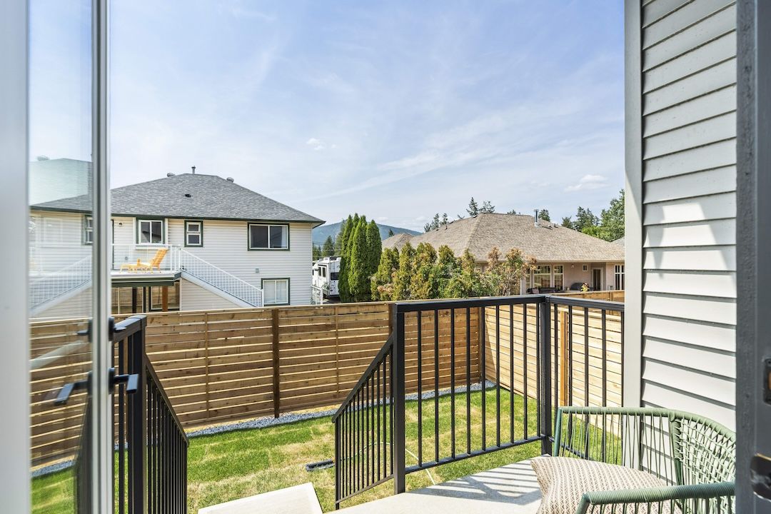 Fully fenced, low-maintenance backyard with deck