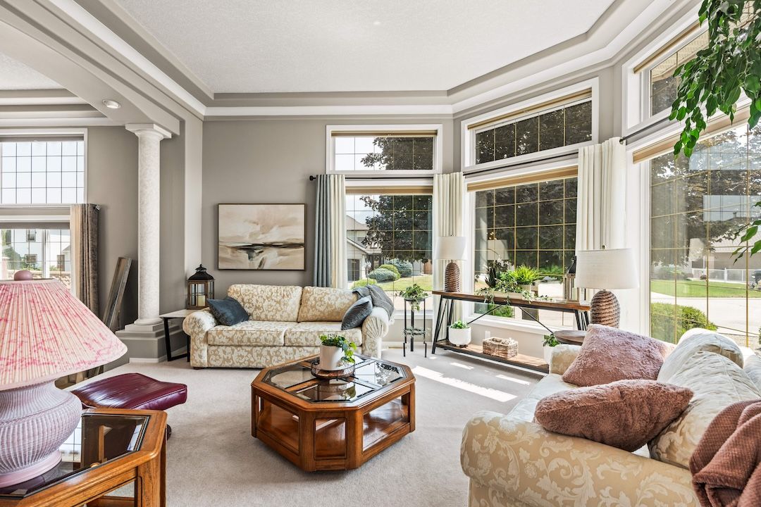 Light-filled formal living room with oversized windows
