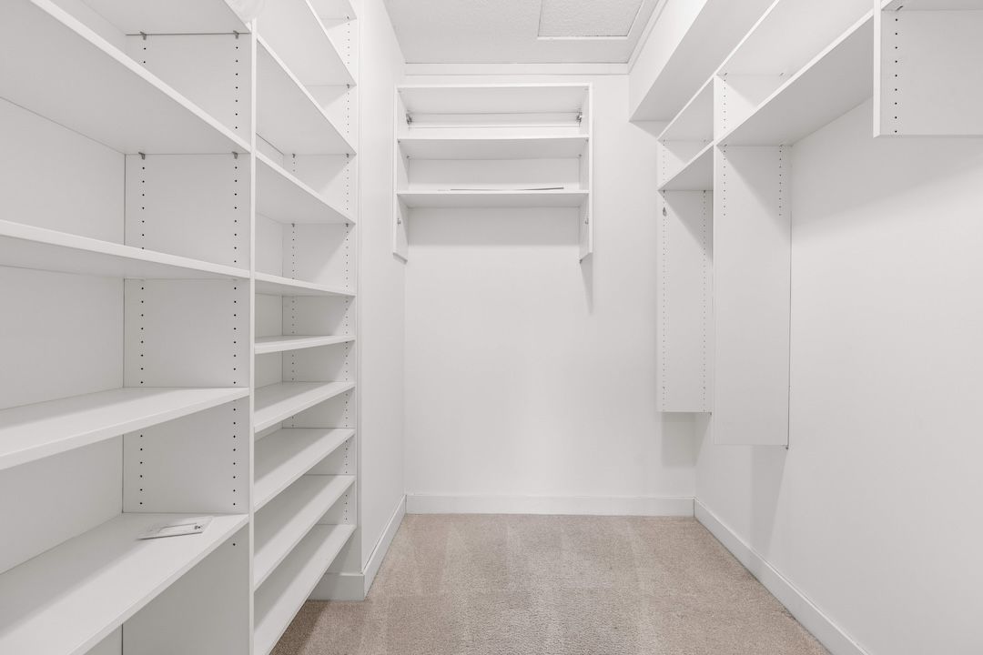 Main-floor primary bedroom with walk-in closet