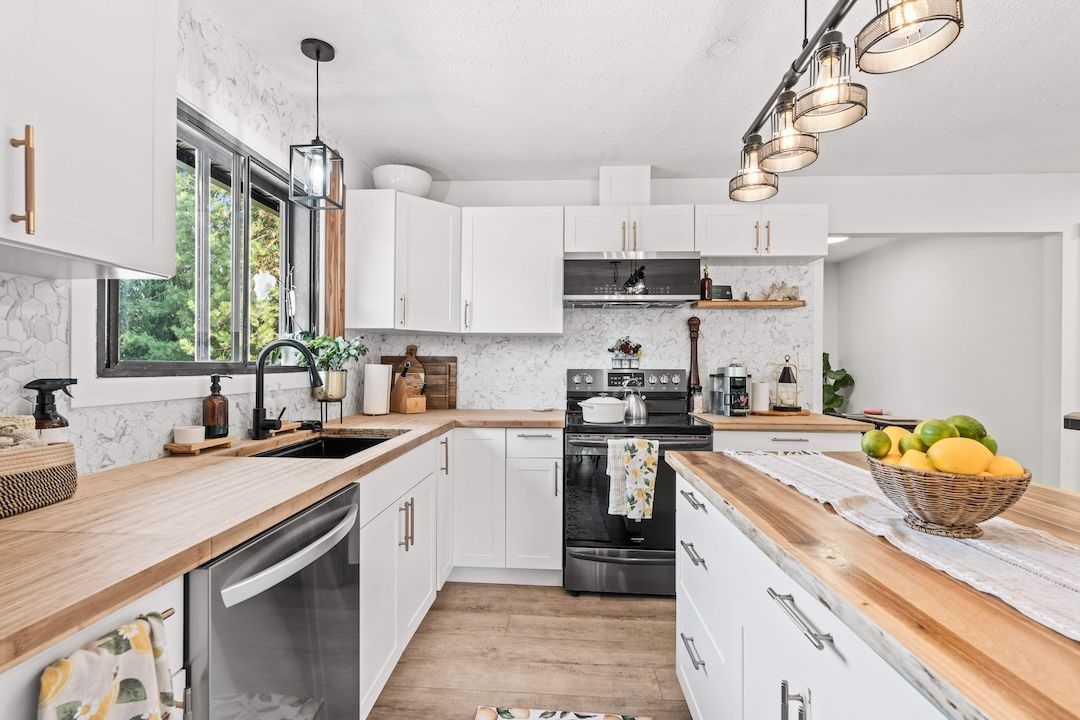 Updated kitchen with island at 3925 Highland Park Crescent