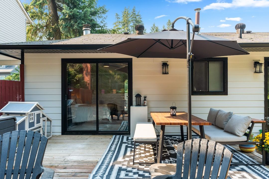 Covered deck and fenced backyard at 3925 Highland Park Crescent