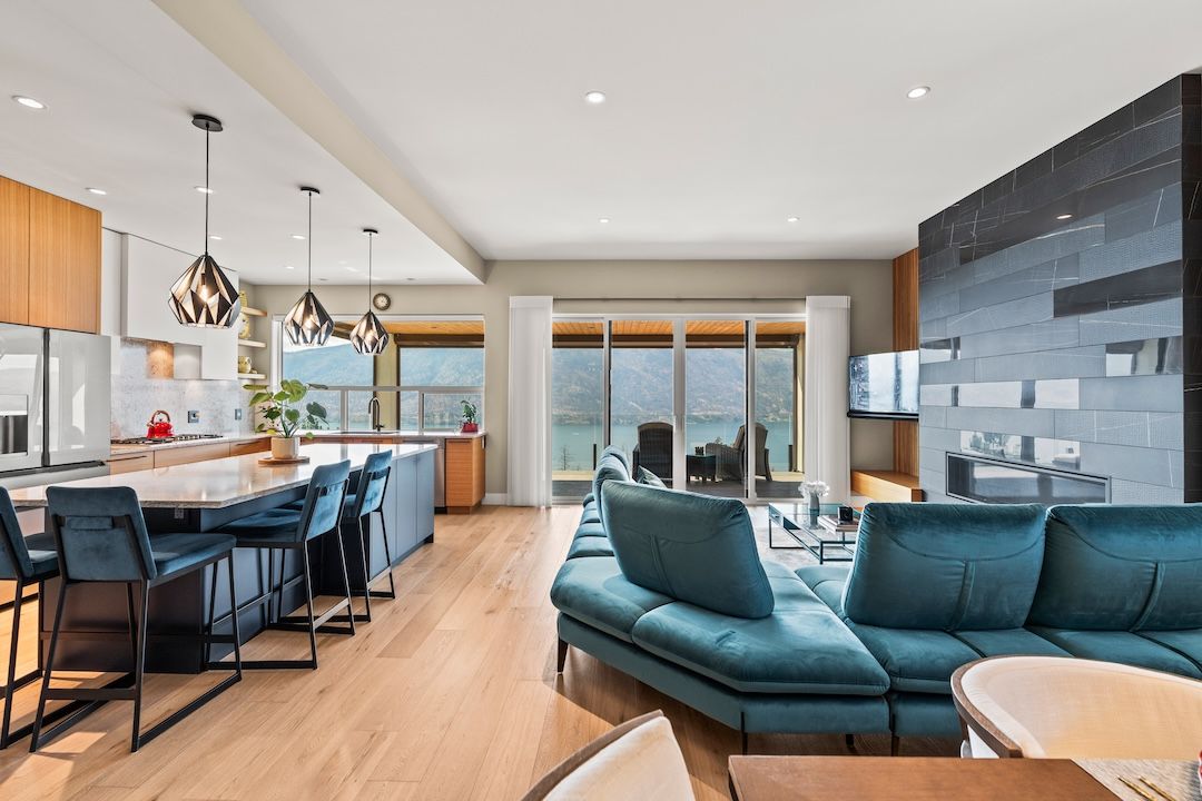 Open living and kitchen area with lake views at 9814 Beacon Hill Crescent