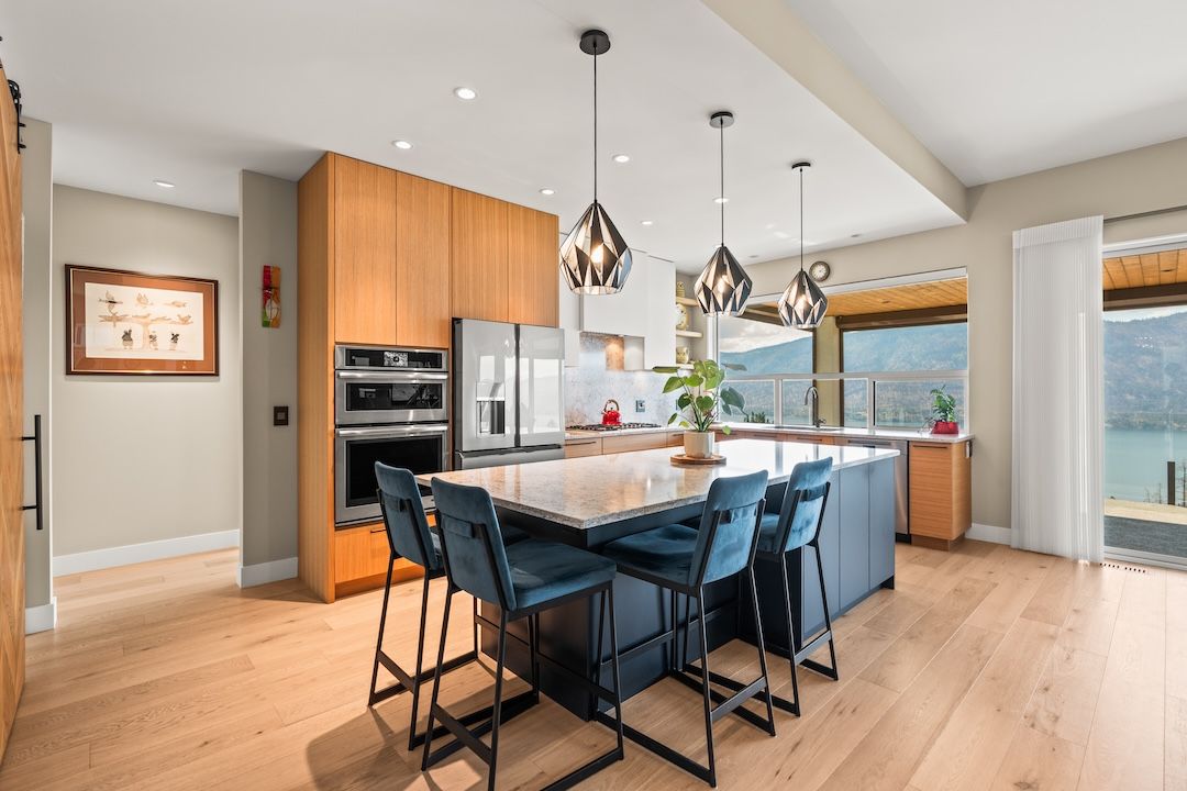 Kitchen with waterfall island and oak cabinetry