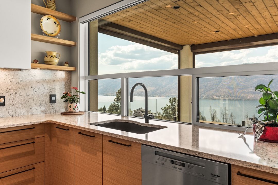 Kitchen sink with lake view — 9814 Beacon Hill Crescent