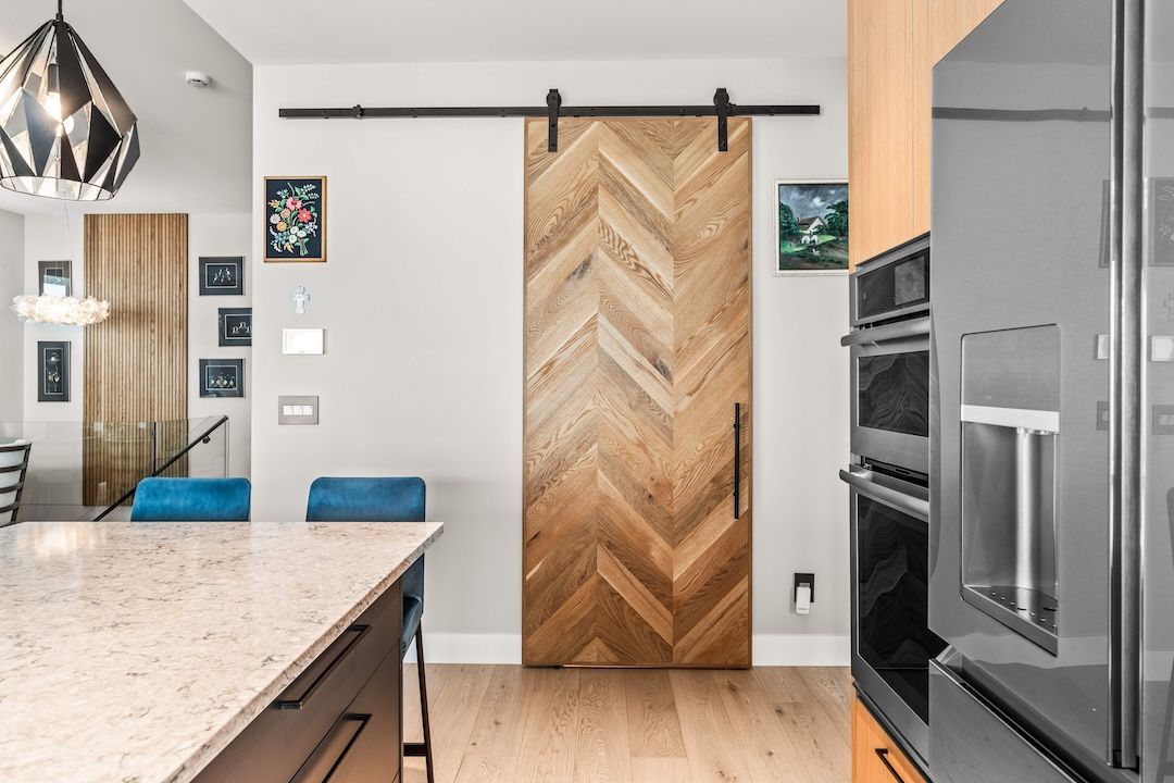 Custom oak barn door at the pantry