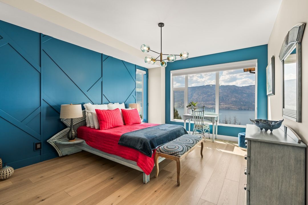 Primary bedroom with lake-facing windows