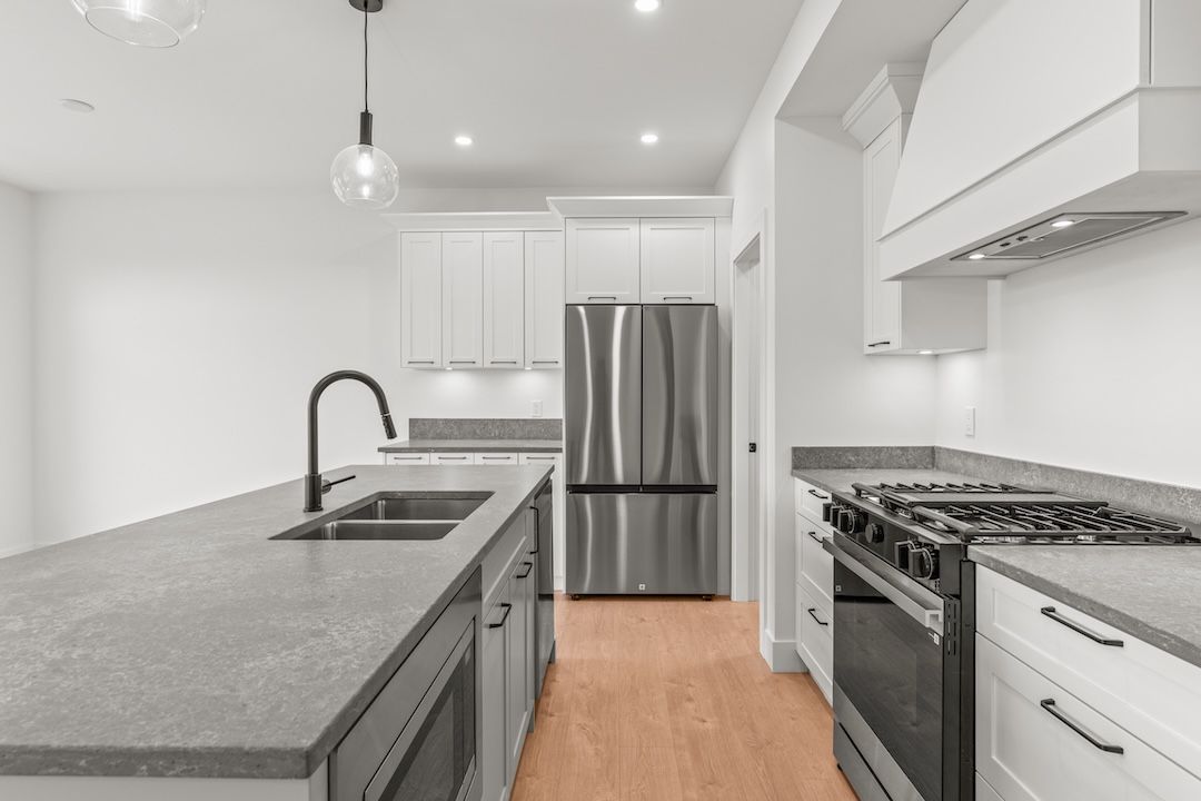 Kitchen and range hood in a similar Wesmont home