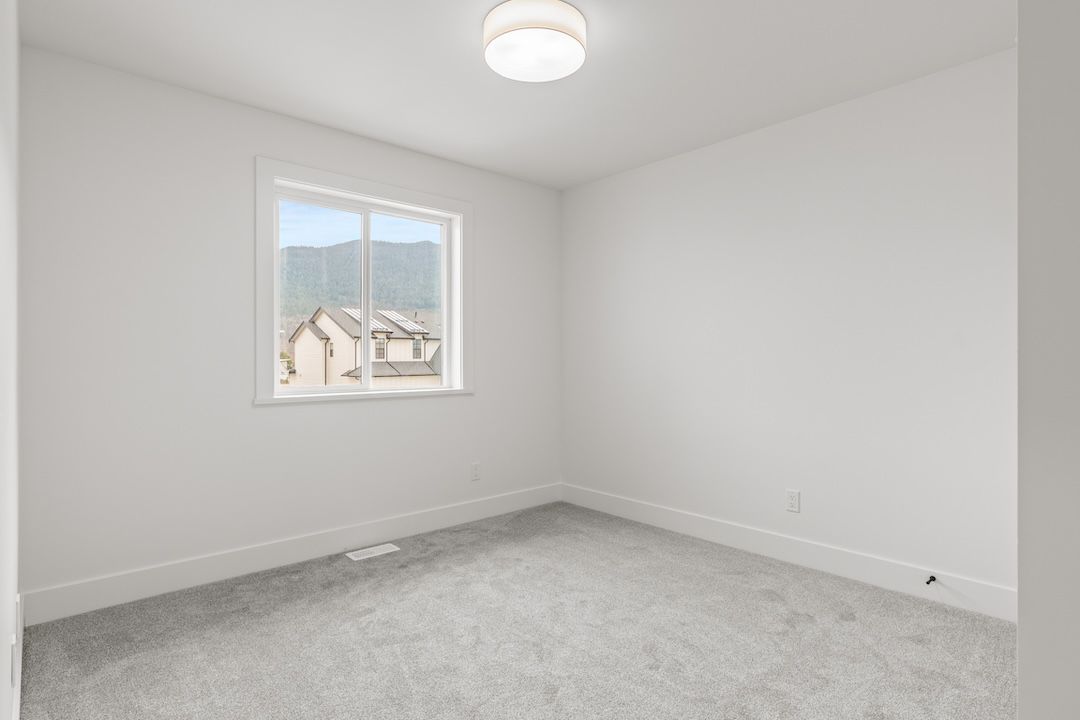 Secondary bedroom in a similar Wesmont home