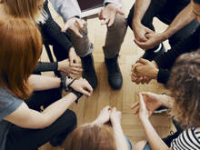 hands in a community circle